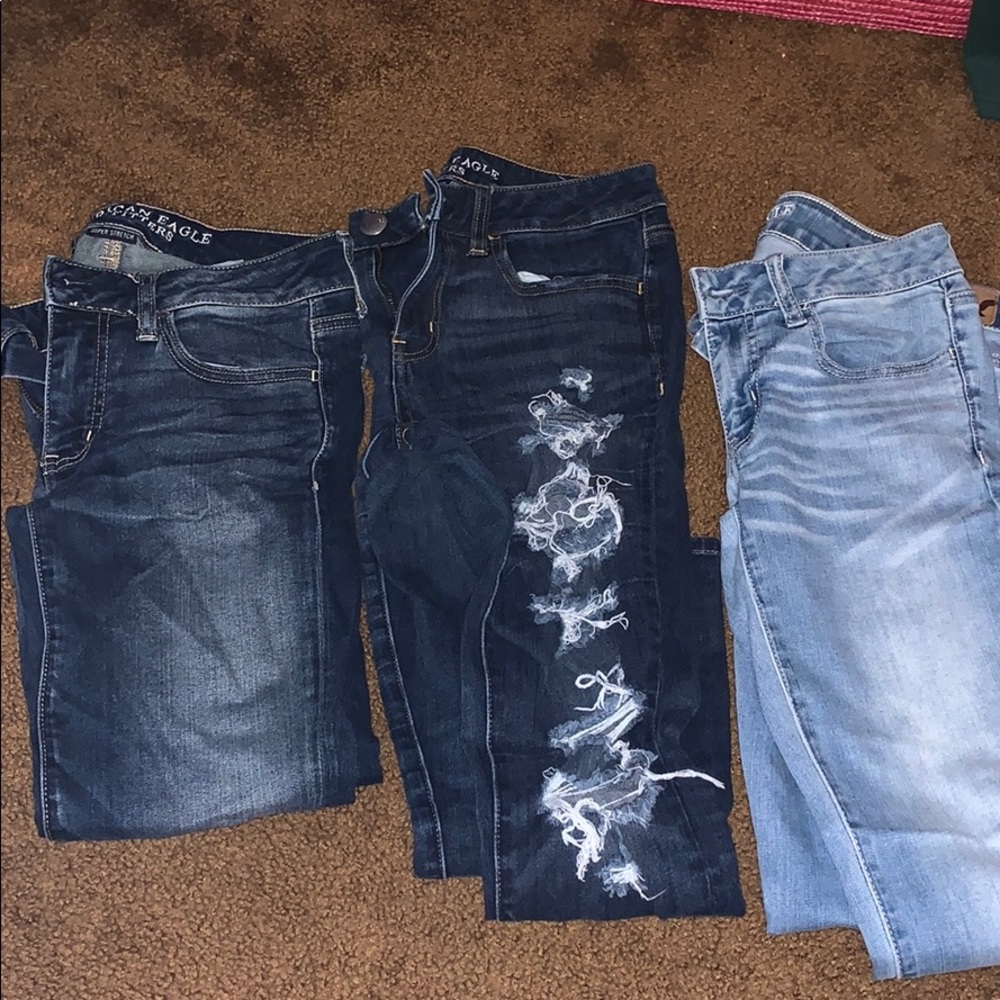 Three pairs of American Eagle jeans